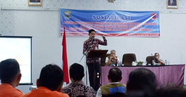 PJ Bupati Muaro Jambi Menutup Sosialisasi Penyelenggaraan Rehabilitasi dan Rekonstruksi Penanganan Pasca Bencana