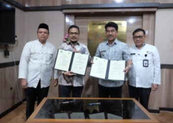 Pj Bupati Muaro Jambi Tandatangani MoU dengan Rektor Universitas Muhammadiyah Jambi